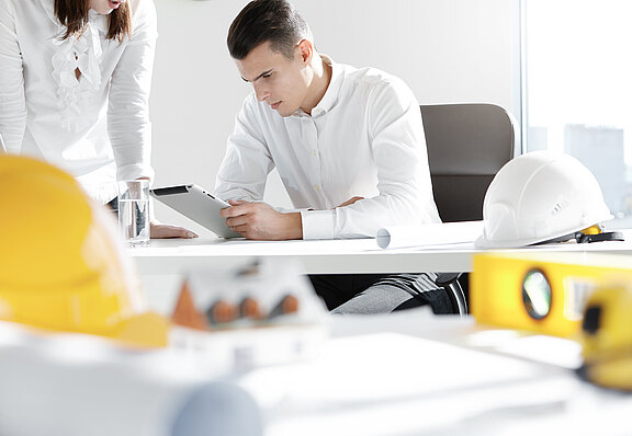 two-engineers-or-designers-working-on-construction-project.jpg